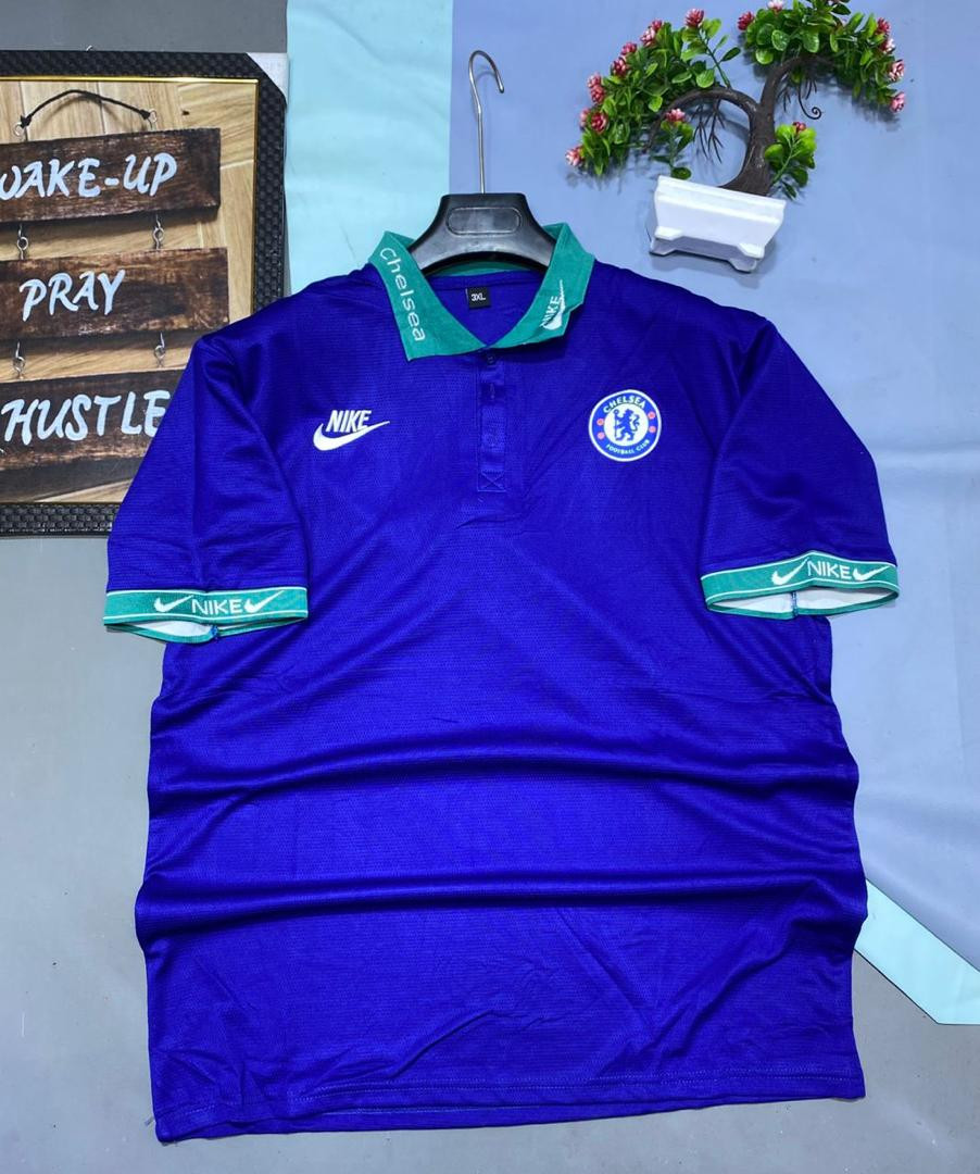 Chelsea FC crest (blue lion circle badge) on right chest