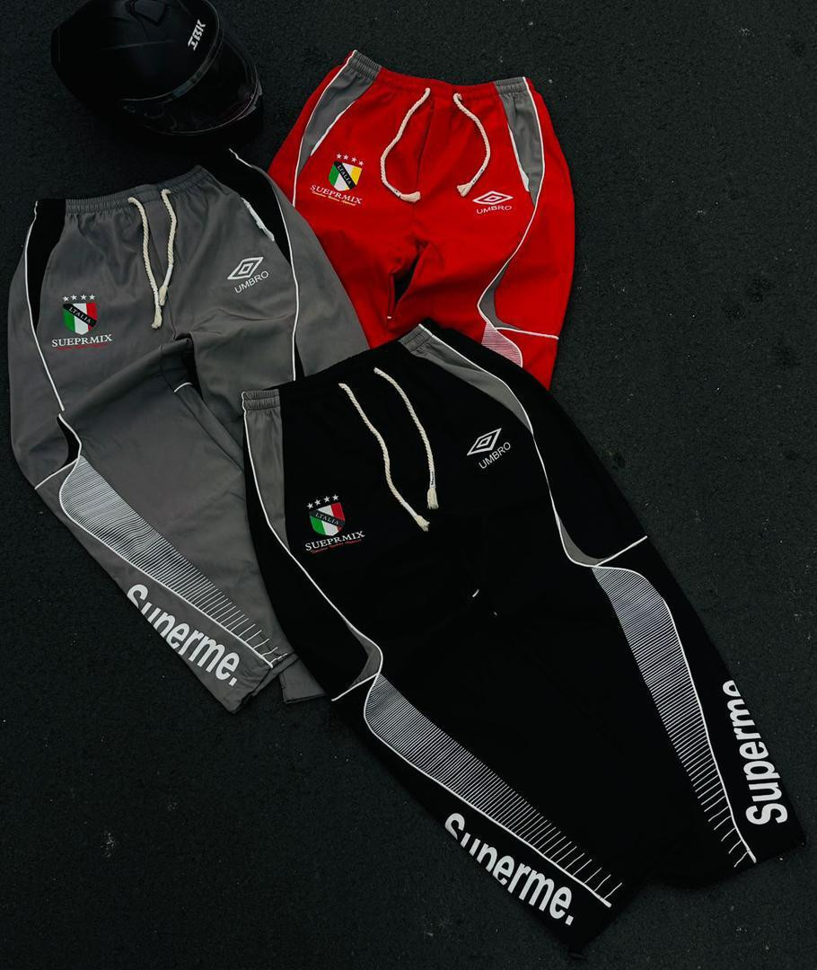 Umbro Supreme Mashup Track Pants Wide Leg Satin Joggers Side Stripe "SUEPRMIX" Logo Casual Streetwear Bottoms Red Gray Black